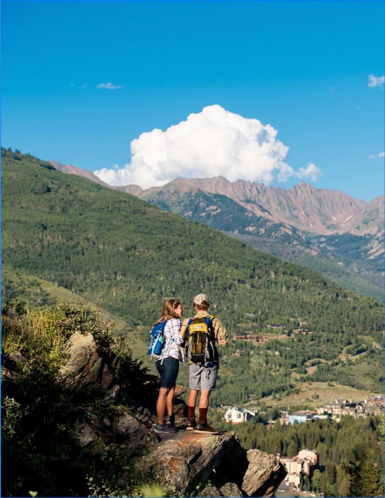 Two people hiking in the mountains.