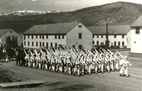 10th Mountain Division soldiers march with skis near Vail, CO, during World War II. They trained at Camp Hale, now a national monument.