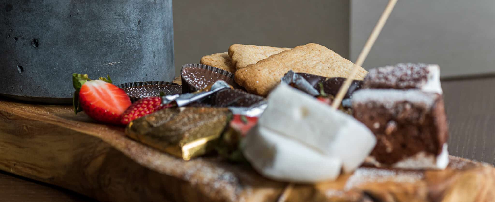 S'more fixings are decoratively placed on a plate near an open flame to make at the table at Grand Hyatt Vail.