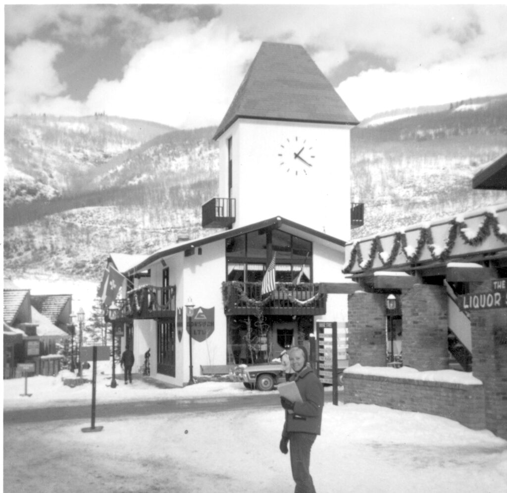 Woman standing in front of clocktower in Vail