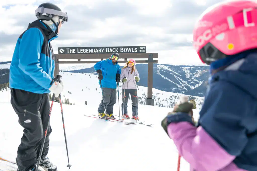 family skiing on the mountain