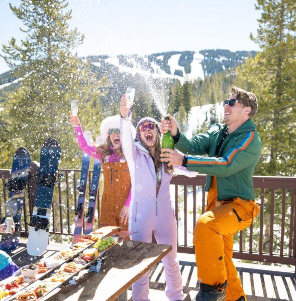 People on the mountain drinking champagne