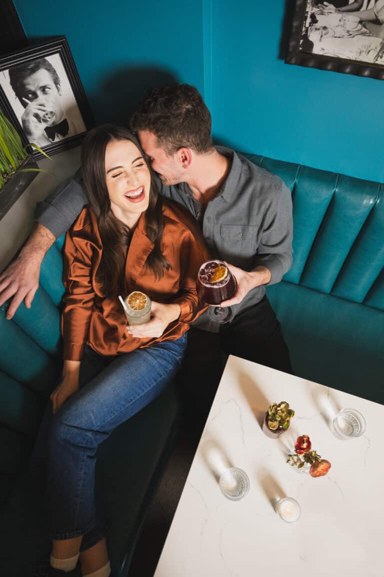 couple at root and flower having drinks