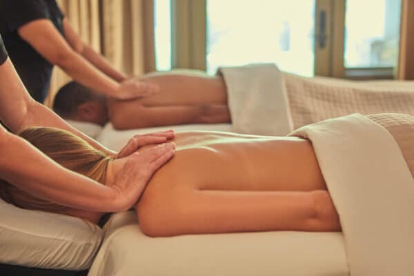 Two people relax during a couple massage at a spa in Vail, Colorado.
