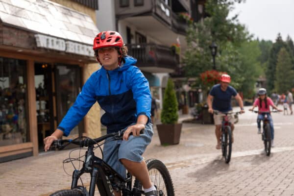 a family biking in vail village