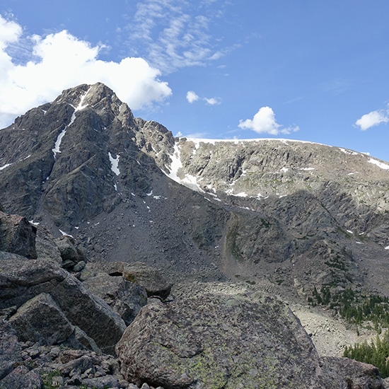 Snow streaks across the rugged summit of Mount of the Holy Cross, an impressive 14er mountain near Vail, Colorado.