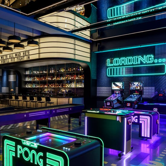 Step into the Rabbit Hole, a neon-lit arcade found within Chasing Rabbits in Vail, Colorado.